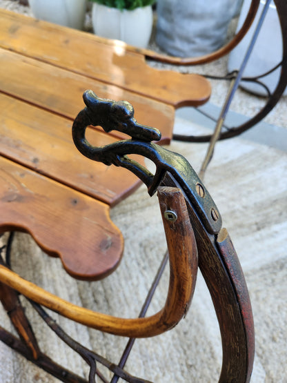 Antique pine sleigh with swan head detail and iron runners
