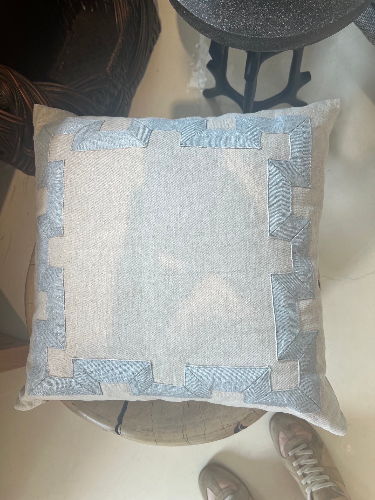 Tan and blue emb outline pillow